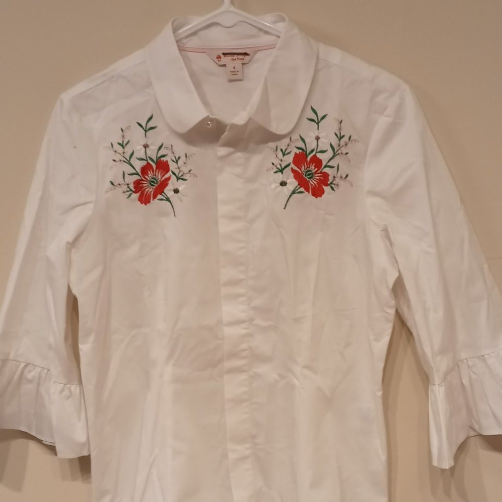 White shirt with embroidery and flare sleeves